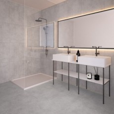 Grijze vloer en wandbetegeling badkamer betonlook