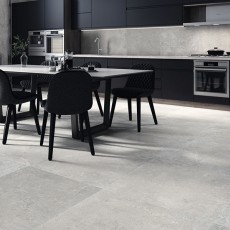 Zwarte keuken op grijze betonlook tegels